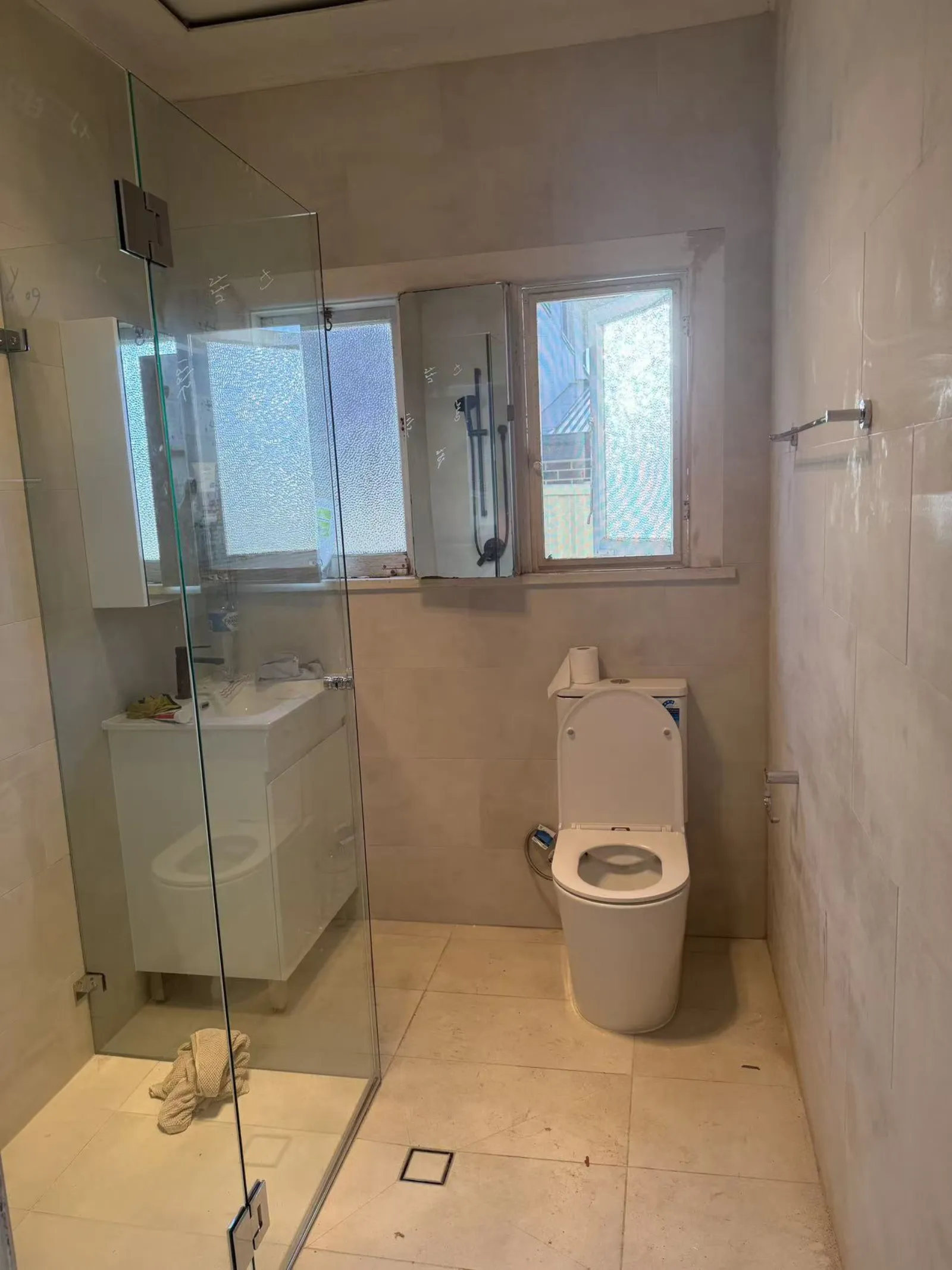 Completed Miranda bathroom with shower, tiled walls, vanity and toilet